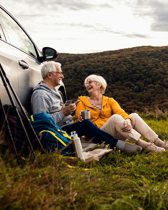 senior couple hiking on country side simple retirement strategy faragi group delaware